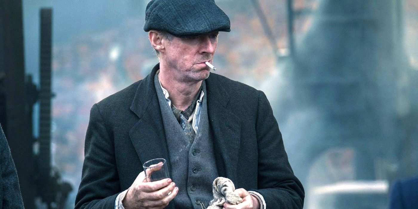 Ned Dennehy as Charlie Strong with a cigarette in his mouth in Peaky Blinders
